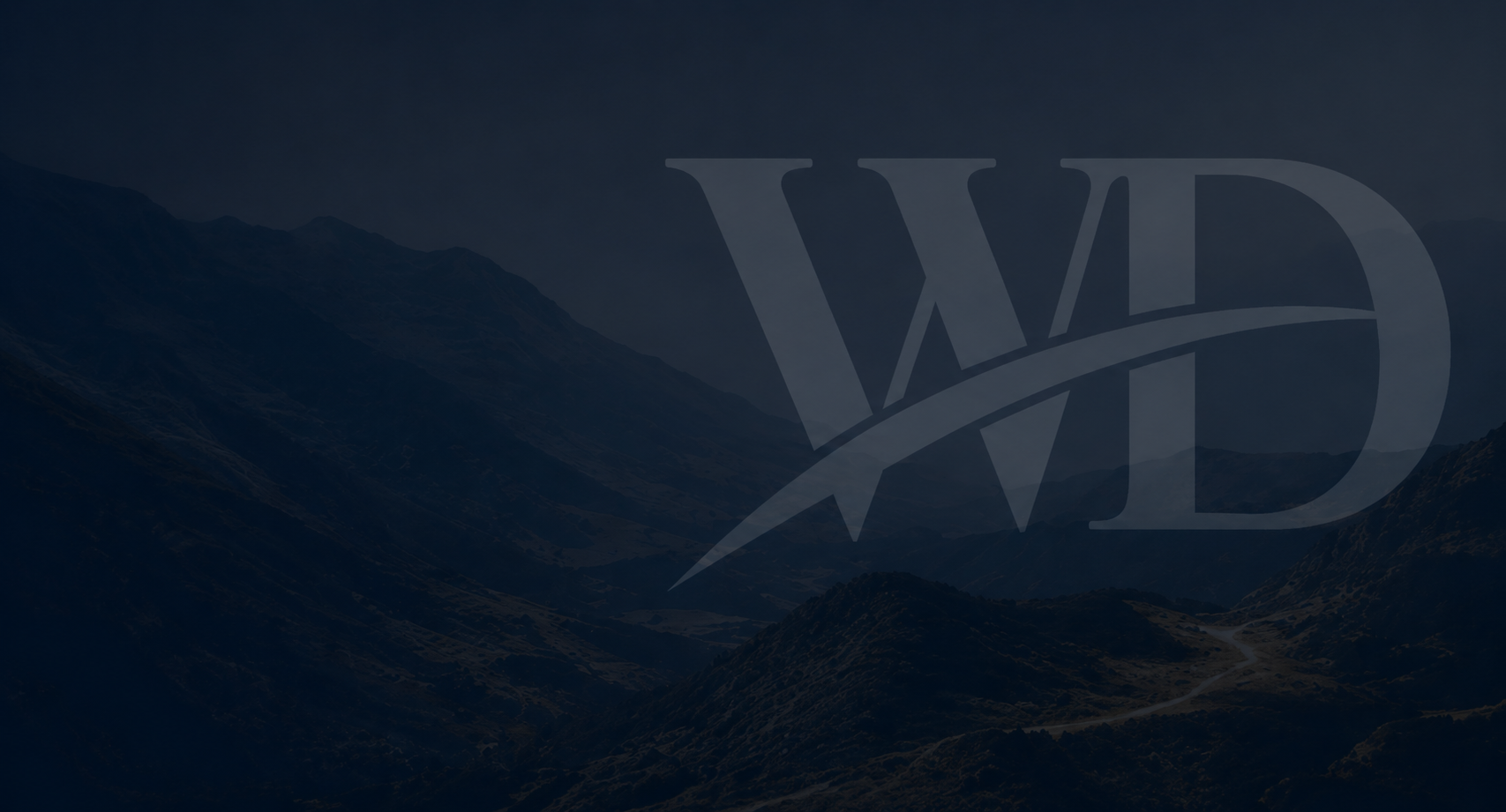 Dark mountain landscape with layered ridges and a large translucent 'WD' logo watermark across the center.